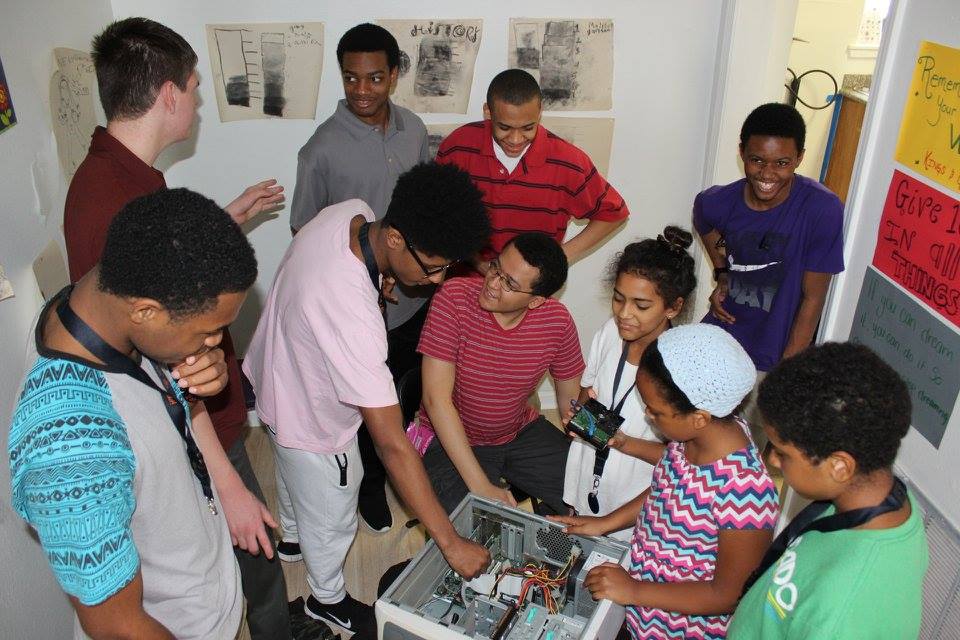 ETHS students leading a hands-on computer lesson with New Orleans participants