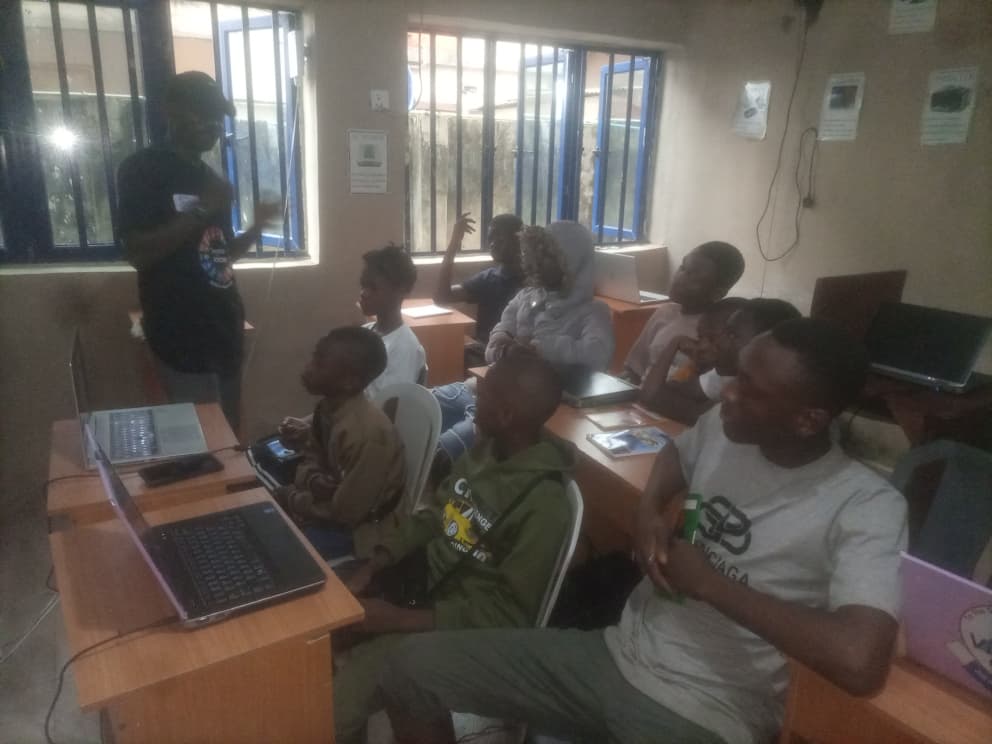 Olumide Kolawole teaching students during a YTC robotics and coding class in Nigeria