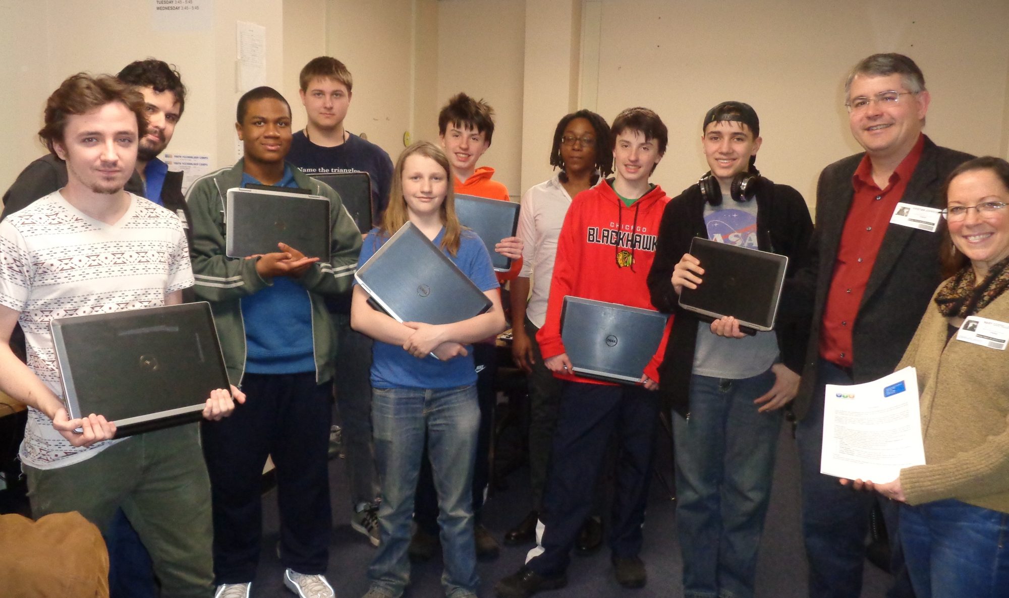 YTC students and partners with laptops prepared for El Salvador