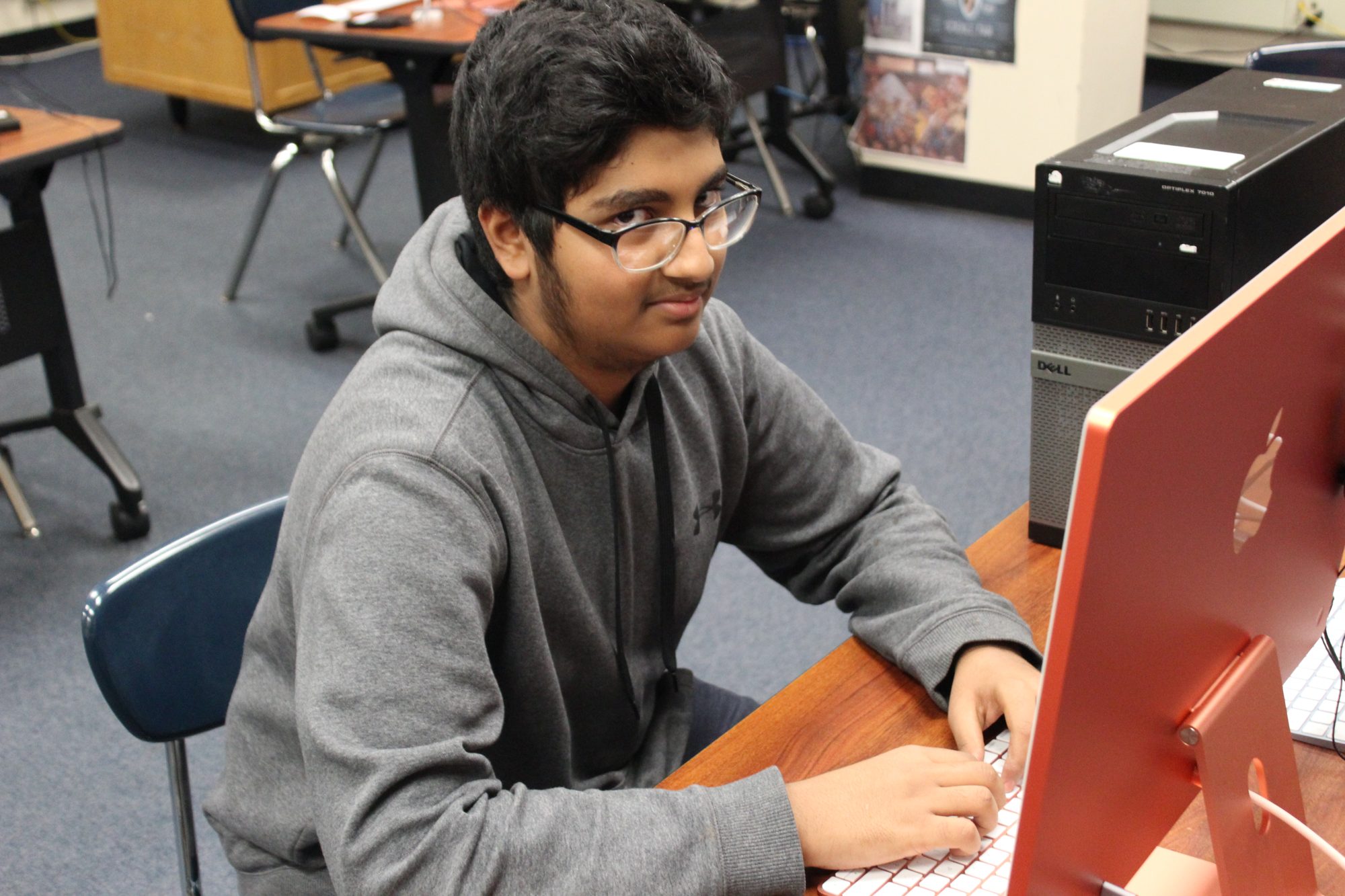 Furqaan working at a computer early in his YTC journey