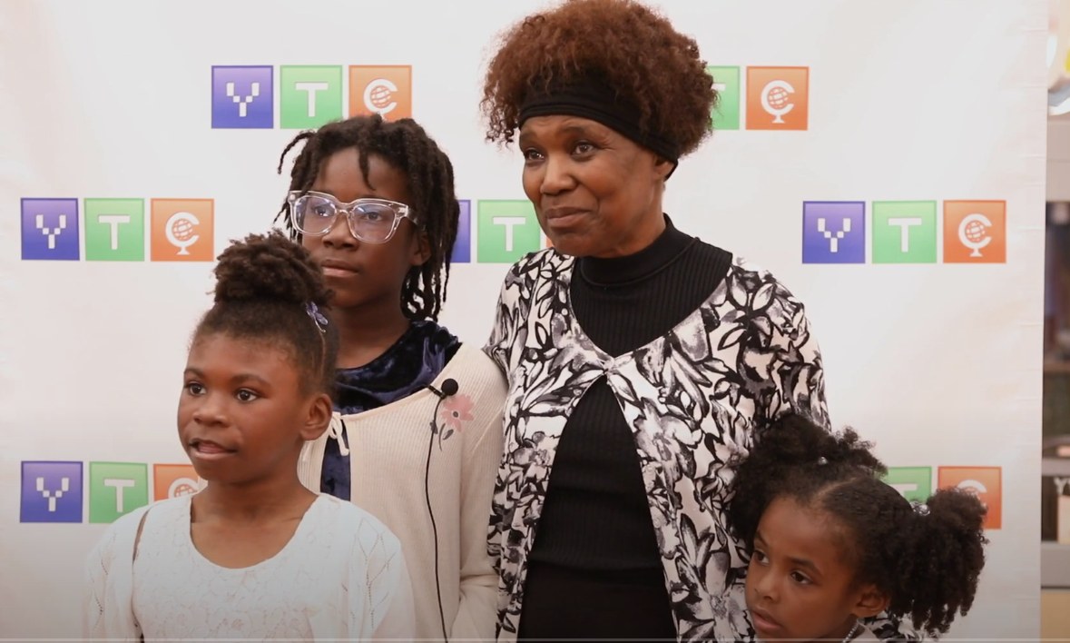A grandmother and three granddaughters at the Camp Kuumba event